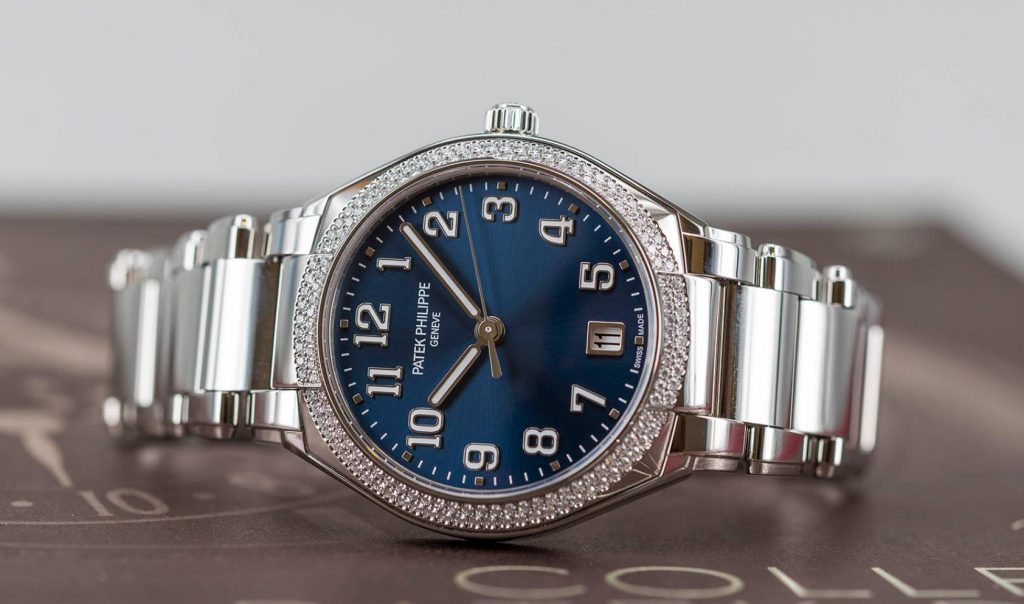 The stainless steel fake watch has a blue dial.